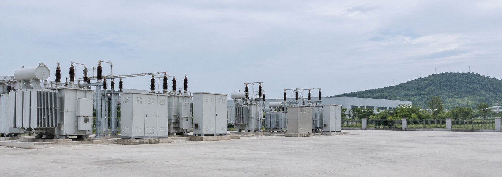 Outdoor power distribution yard with transformers and switchgear