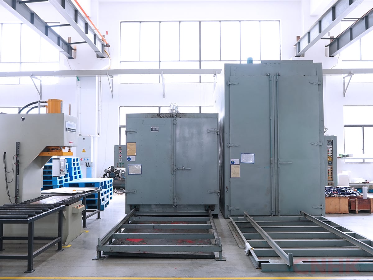 Hydraulic press and curing ovens in the processing hall